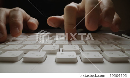 Close-up soft-focus finger typing on keyboard. Close-up soft-focus finger typing on keyboard. 59304593