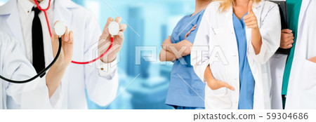 Doctor working in hospital with other doctors. Doctor working in hospital with other doctors. 59304686