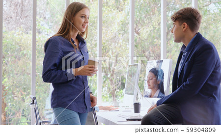 Businesswoman and businessman having conversation. Businesswoman and businessman having conversation. 59304809