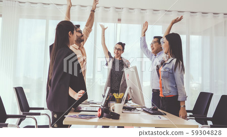 Successful business people celebrating success. 59304828