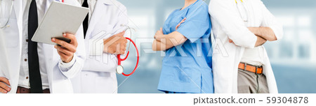 Doctor working in hospital with other doctors. Doctor working in hospital with other doctors. 59304878