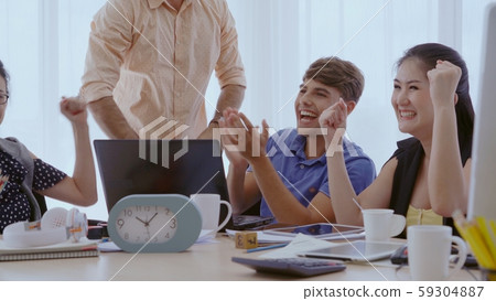 Successful business people celebrating success. 59304887
