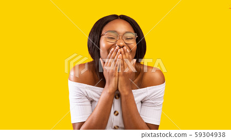 Black Girl Laughing Covering Mouth With Hands, Studio Shot, Panorama 59304938