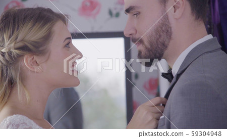 Bride and groom in wedding dress prepare ceremony. Bride and groom in wedding dress prepare ceremony. 59304948