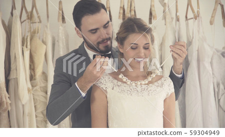 Bride and groom in wedding dress prepare ceremony. 59304949