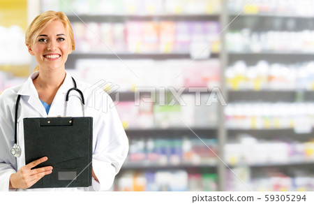Woman pharmacist working at pharmacy. 59305294