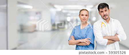 Doctors at hospital working with another doctor. 59305326