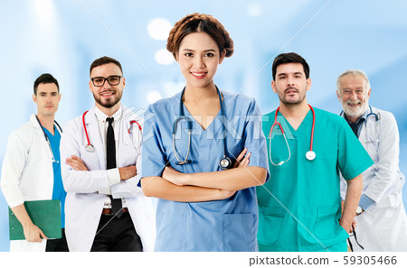 Doctor working in hospital with other doctors. 59305466