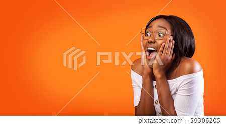 Surprised Woman Shouting With Hands On Cheeks Standing, Studio, Panorama 59306205