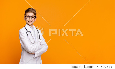 Confident teen doctor with stethoscope posing with arms crossed Confident teen doctor with stethoscope posing with arms crossed 59307545
