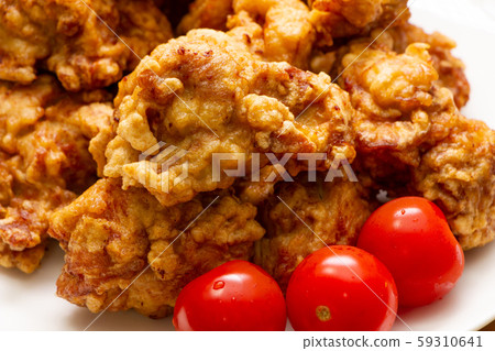 Fried chicken. Mini tomatoes for garnish. Fried chicken. Mini tomatoes for garnish. 59310641