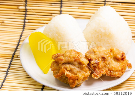 Deep-fried chicken (with set of triangular rice balls and pickles). Deep-fried chicken (with set of triangular rice balls and pickles). 59312019
