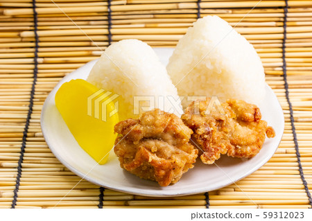 Deep-fried chicken (with set of triangular rice balls and pickles). Deep-fried chicken (with set of triangular rice balls and pickles). 59312023