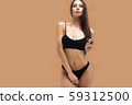 Sexy woman in underwear looking at camera 59312500