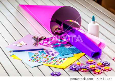 Crafting a candy cone from paper for the first day of school 59312758