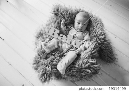 newborn baby wrapped in a blanket sleeping in a basket. concept of childhood, healthcare, IVF. Black and white photo newborn baby wrapped in a blanket sleeping in a basket. concept of childhood, healthcare, IVF. Black and white photo 59314499