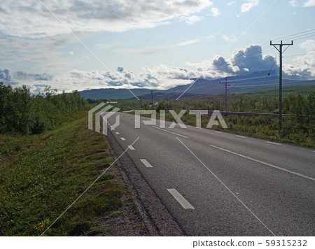 Lonely winding asphalt road and railroad in Abisko Lonely winding asphalt road and railroad in Abisko 59315232