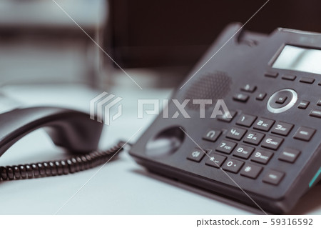 Closeup iphone on the wood floor,IP Phones for business communication between organizations Closeup iphone on the wood floor,IP Phones for business communication between organizations 59316592