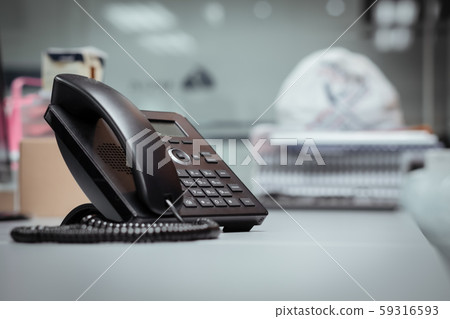 Closeup iphone on the wood floor,IP Phones for business communication between organizations Closeup iphone on the wood floor,IP Phones for business communication between organizations 59316593