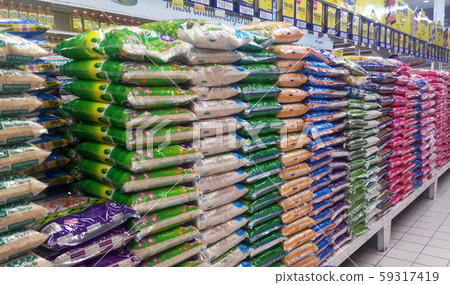 The rice in the plastic packaging is stacked inside the supermarket for sale. Variety of type and price 59317419