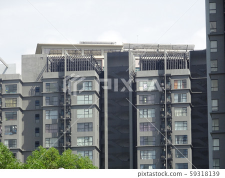 High rise residential apartment building with modern facade design. Apartment housing popular especially in the urban area in Malaysia. High rise residential apartment building with modern facade design. Apartment housing popular especially in the urban area in Malaysia. 59318139