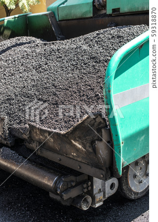 Asphalting machine on the road. Asphalting machine on the road. 59318870
