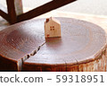 Toy house on stump 59318951