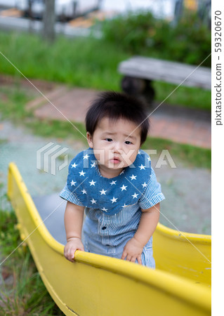 Infants playing in the park 59320670