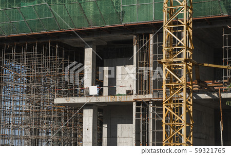 Building and Construction Site in progress. Building construction site against blue sky. Metal 59321765