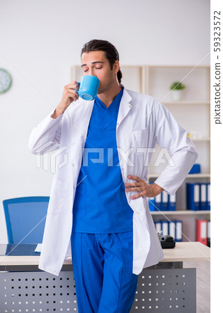 Young male doctor working in the clinic 59323572