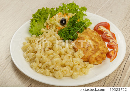 Pasta with a piece of grilled meat and salad. 59323722