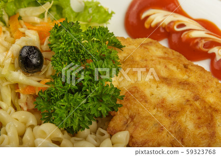 Pasta with a piece of grilled meat and salad. 59323768