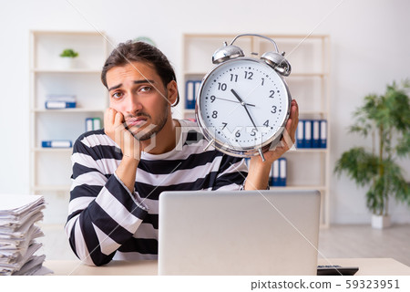 Young employee feeling like prisoner at work 59323951