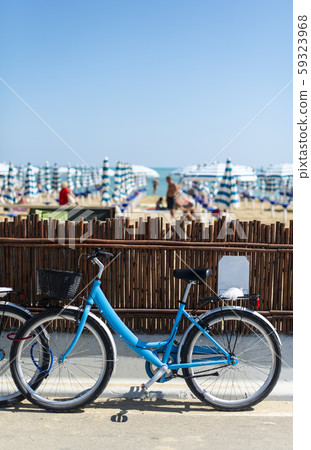 Rental bikes on the beach. Blue bicycles on the 59323968