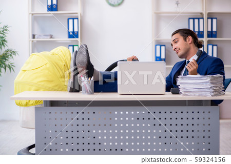 Young father looking after newborn in the office Young father looking after newborn in the office 59324156