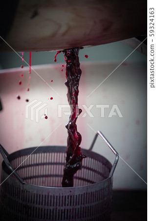 Wine mixing during fermentation process in barrel, Bordeaux Vineyard 59324163