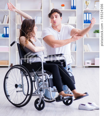 Patient undergoing rehabilitation recovery programme with doctor Patient undergoing rehabilitation recovery programme with doctor 59324166