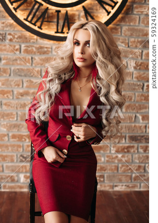 Gorgeous blonde woman in bright black dress on Gorgeous blonde woman in bright black dress on 59324169