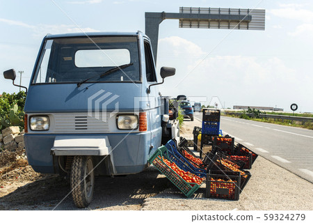 Small italian apo truck with tomatoes. Farmer sale Small italian apo truck with tomatoes. Farmer sale 59324279