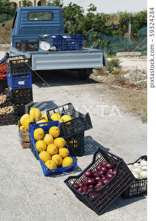 Small italian apo truck. Street vegetable market. 59324284