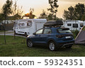 Caravans and campers on green meadow in campsite. 59324351