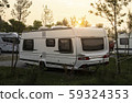 Caravans and campers on green meadow in campsite. 59324353