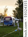 Caravans and campers on green meadow in campsite. 59324355