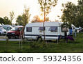 Caravans and campers on green meadow in campsite. 59324356