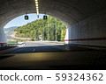 Highway tunnel. Signs in tunnel. Mountain road. 59324362