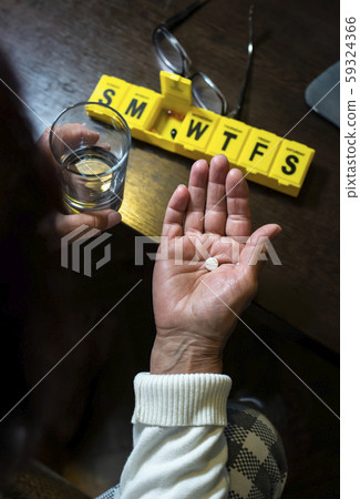 Senior woman take pills from box. Healthcare and Senior woman take pills from box. Healthcare and 59324366