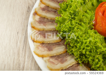 Sausage cuts of different varieties on a plate. 59324369