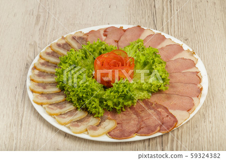 Sausage cuts of different varieties on a plate. 59324382