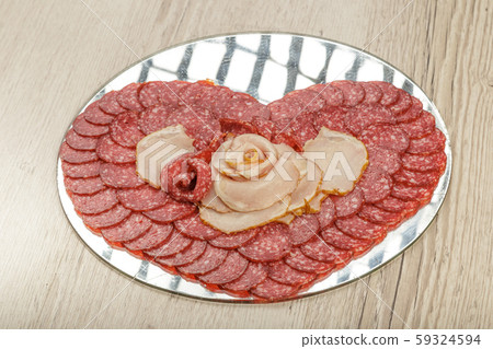 Sausage cuts of different varieties on a plate. 59324594