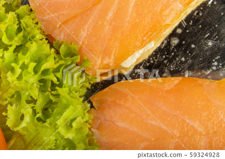 Dish of sandwiches with red fish tomato and greens 59324928